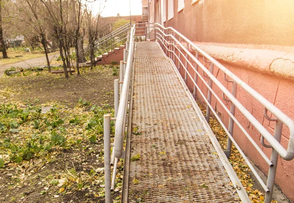 Metal ramp for movement and barrier-free access for wheelchairs, outdoor.