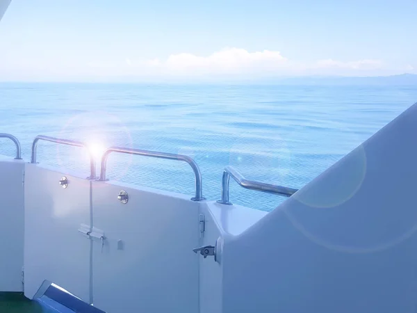 Close-up of the ship's side, the view from the deck of the yacht at dawn on the sea, calm and serenity.