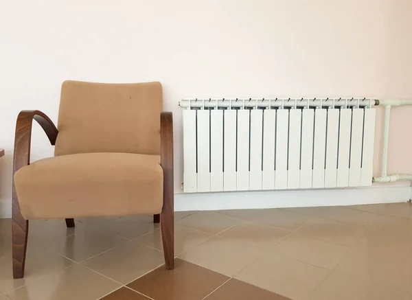 Modern Aluminum White Heating Radiator Fashionable Brown Armchair Background Wall — Stock Photo, Image