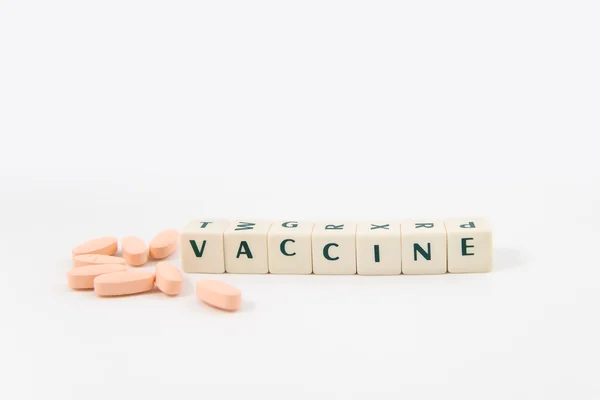 Εμβόλιο λευκό κύβο κείμενο — Φωτογραφία Αρχείου