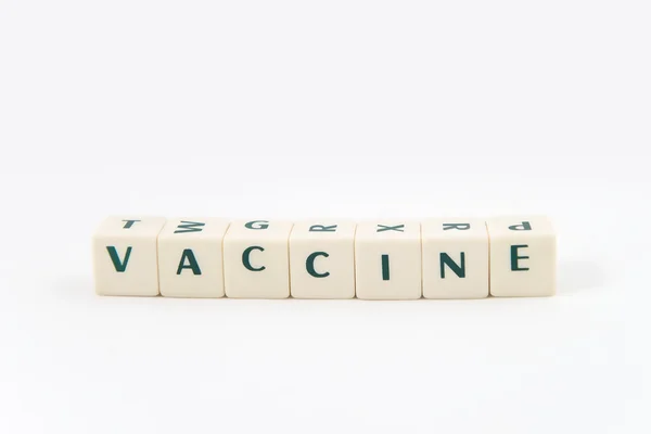 Εμβόλιο λευκό κύβο κείμενο σε λευκό φόντο — Φωτογραφία Αρχείου