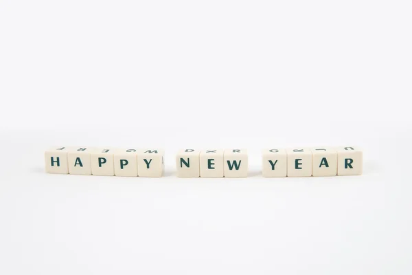 Happy NEW Year white cube text and Teddy bear on white background — Stock Photo, Image