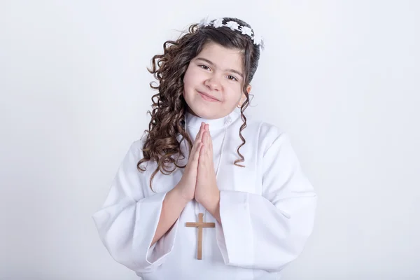 Little girl posing for the first communion Royalty Free Stock Images
