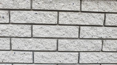 Duvar ve zemin ustası. Çeşitli taş dokuları. Çok renkli bir arka plan. Boşluğu kopyala.