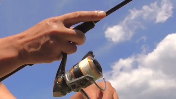 The coil for fishing on a spinning — Stock Video