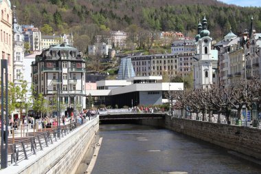 KARLOVY VARY, CZECH - APRIL 26, 2012: This is the new Hot Spring Colonnade over the Tepla River in the center of the spa town.