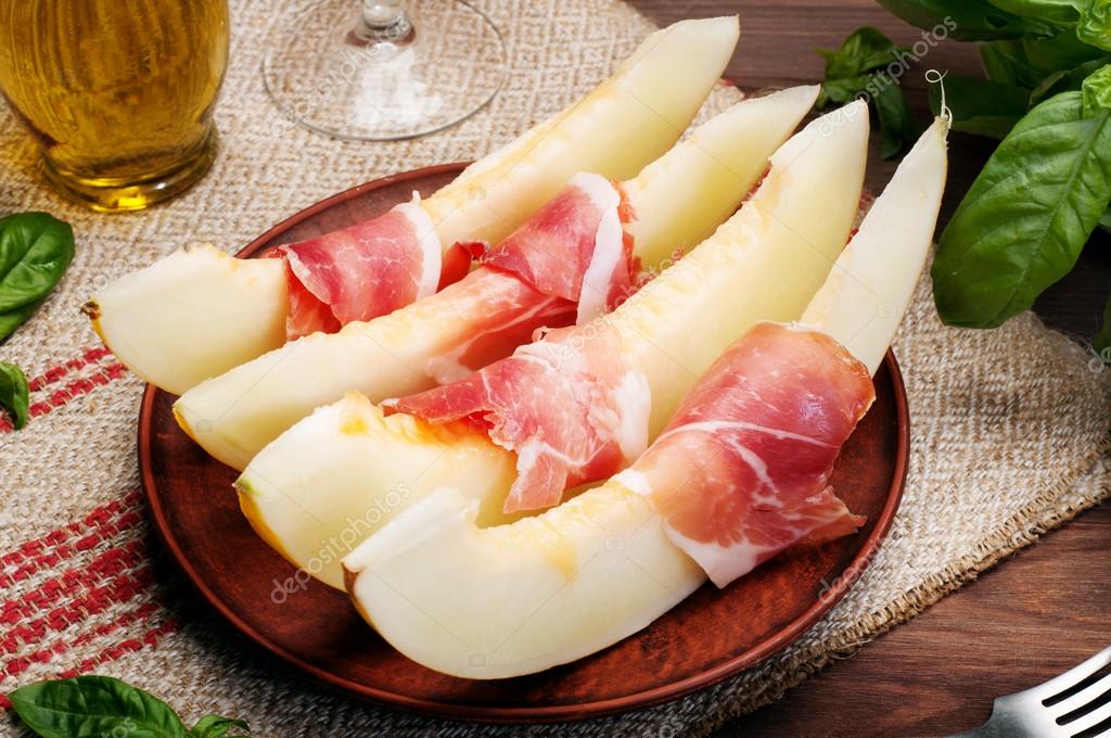 Classical Spanish appetizer with melon and jamon. Tapas. Refined and