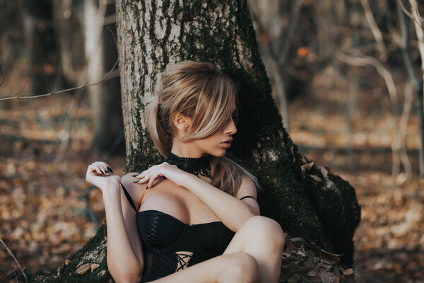 Beautiful woman posing in the forest