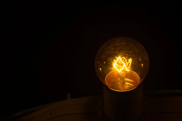 Light bulb in the dark night