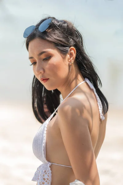 Portrait of woman posing outdoors at the sea beach