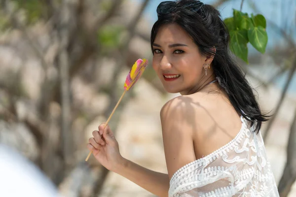 Portrait of woman posing outdoors at the sea beach