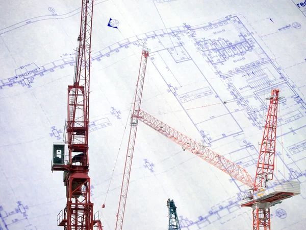 Contruction crane with blue print — Stock Photo, Image