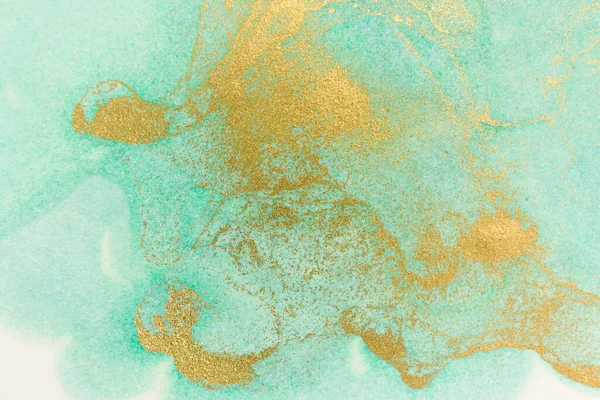 Watercolor green and gold abstract stains background.