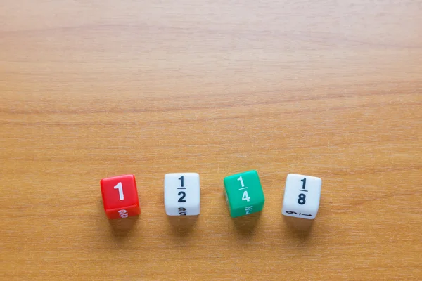 Fraction dices on wood table — Stock Photo, Image