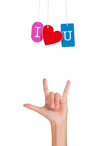 Hand mit Fingern, die ein Liebeszeichen bilden und ich liebe dich hängende Tags — Stockfoto