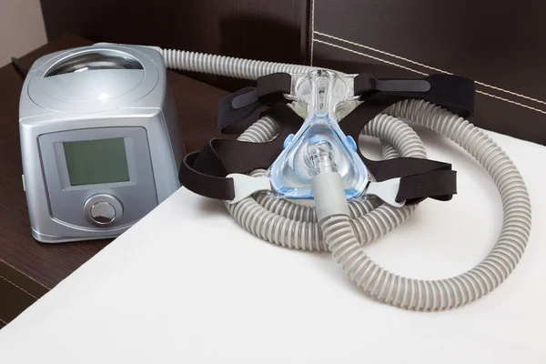 Sleep Apnea CPAP mask, hose, headgear, and machine — Stock Photo, Image
