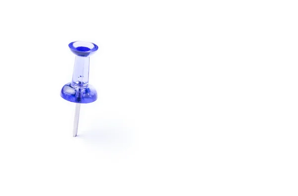 Blue translucent push pin on white paper — Stock Photo, Image