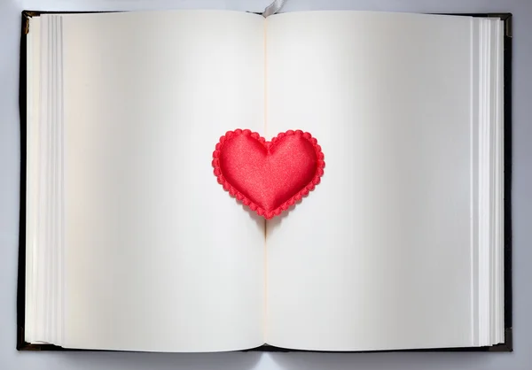 Red hearts on an open book — Stock Photo, Image