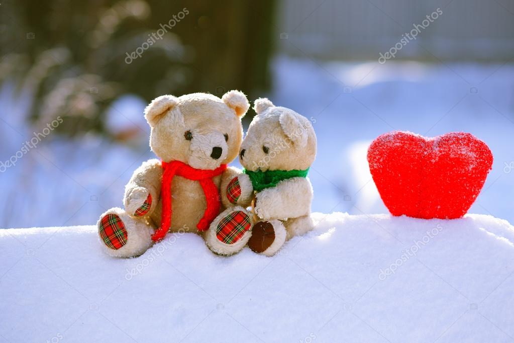 two teddy bears hugging