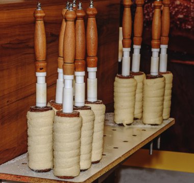 Sweet tasteful traditional slovak and czech roasted delicacy - vanilla trdelnik. Created by baking on a cylindrical spit