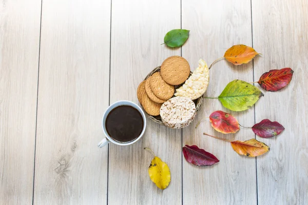 Breakfast, on the background of light oak boards, with elements of autumn decor