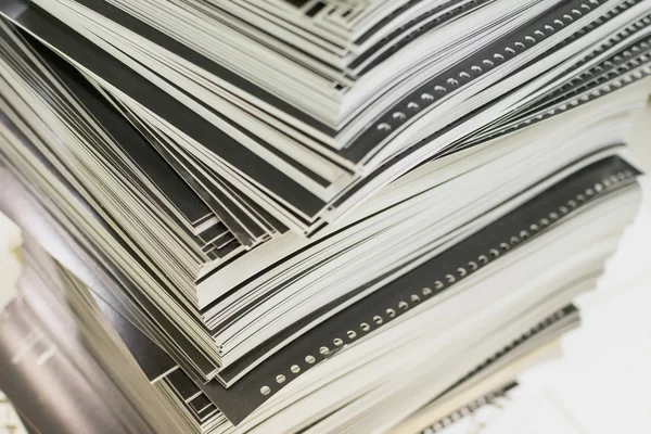 Close-up of stacked perforated printed sheets — Stock Photo, Image