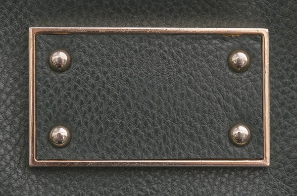 imitation leather tag with metal border and rivets