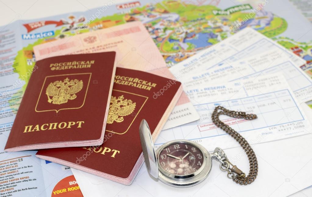 passports, ticket, watch and map