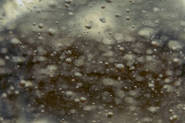 Kabarcıklı şeffaf jeli kapat. Doku sıvısı jel kreminin arka planı.