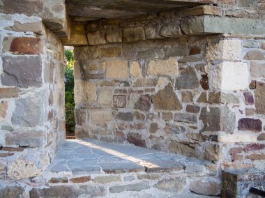 Fragment of the fortress wall with a loophole. Genoese fortress, Sudak, Crimea
