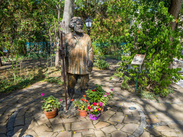 Koktebel, Crimea - September 16, 2020: Statue of Maximilian Voloshin by sculptor Korzhev-Chuvilev, Koktebel, Crimea