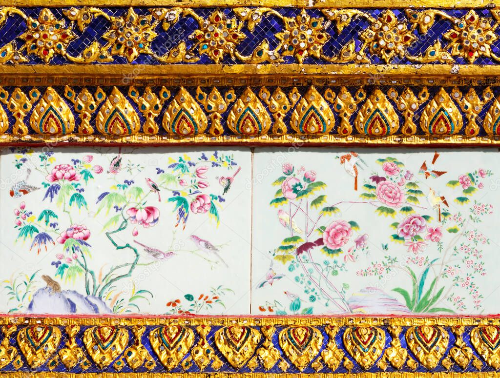 Ancient ceramic tiles with paintings, fragment of the design Of the temple of the Emerald Buddha, grand palace or wat phra kaew Bangkok Thailand. These images are the public domain and a treasure of Buddhism, no restrict in copy or use