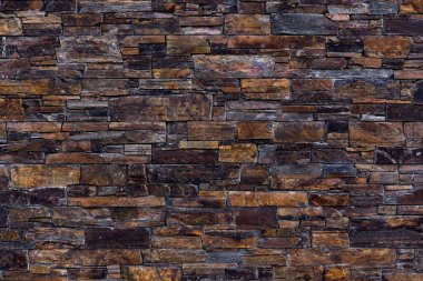 Koyu kahverengi duvar, doğal kayrak taşı. arkaplan, doku
