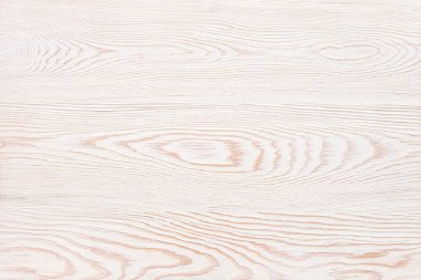 Beyaz, ahşap bir arka plan ve belirgin bir dokusu var.