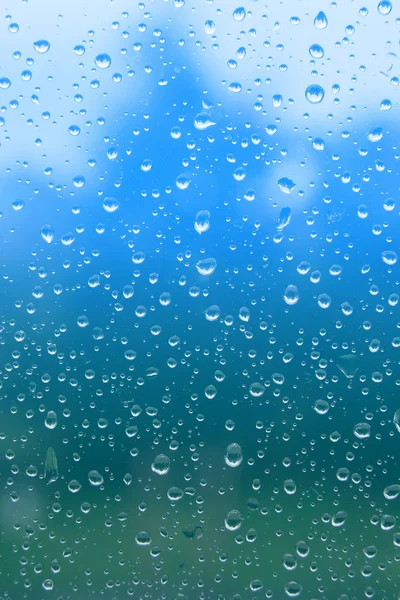 Gotas de lluvia en ventana de vidrio. — Foto de Stock
