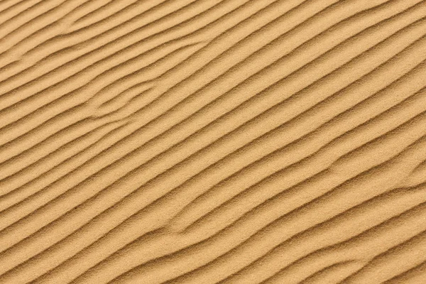 Sand texture.Dented wave of the blow of the wind. — Stock Photo, Image
