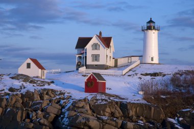 Snow Covered Lighthouse In Maine During Holidays clipart