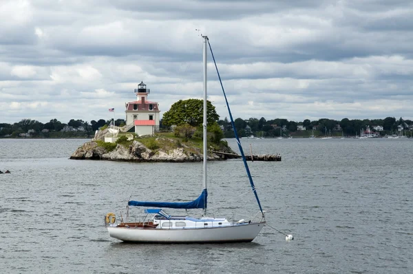 Sailboat by Lighthouse as Storm Clouds Break — Stock Photo, Image