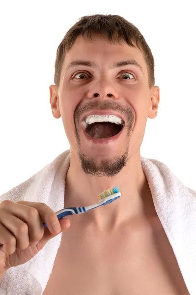 Fou adulte mâle avec brosse à dents blanche et bleue à la main — Photo