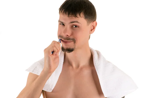 man cleaning his teeth with toothbrush