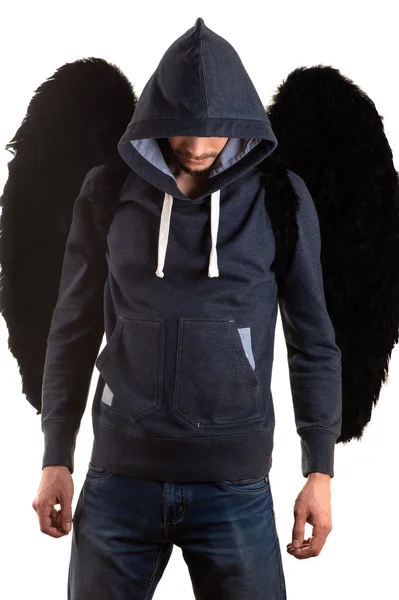 young man standing with her hands on back and black wings