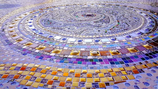 Spiral pattern purple and gold colors mosaic floor — Stock Photo, Image