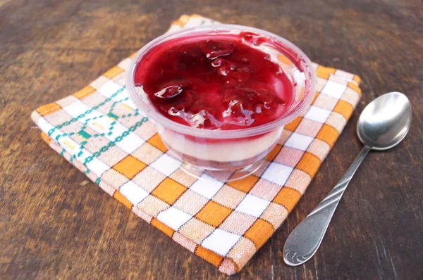 Parfait dessert with berries, milk souffle and jello layers. Treat in a glass on a rustic wooden background — Stock Photo, Image