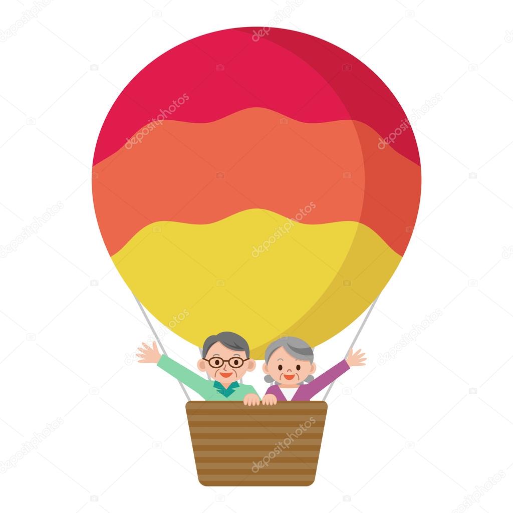 Senior couple riding a balloon