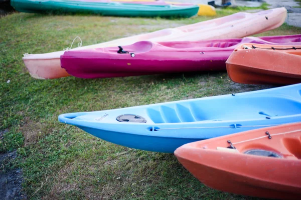 Colorful plastic boat at the lake side — Stock Photo, Image