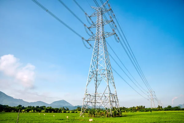 Overhead eletrical transmission line crossing the rice field at Philippine countryside.