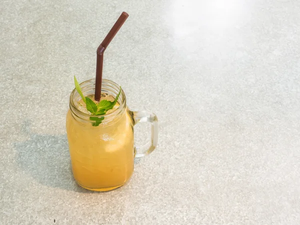 Jug of lemonade with honey and mint on table — Stock Photo, Image