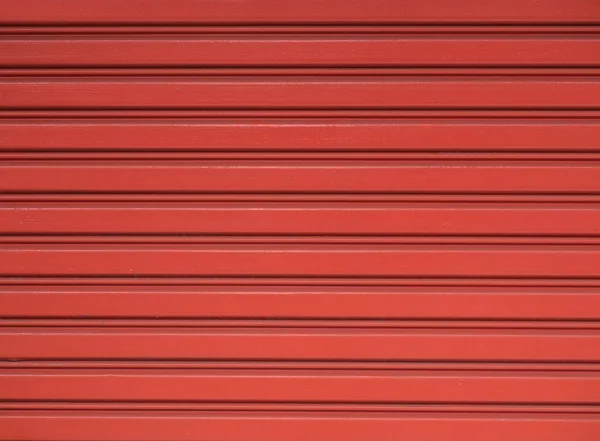 Červená ocelové rolovací vrata závěrky pro pozadí — Stock fotografie