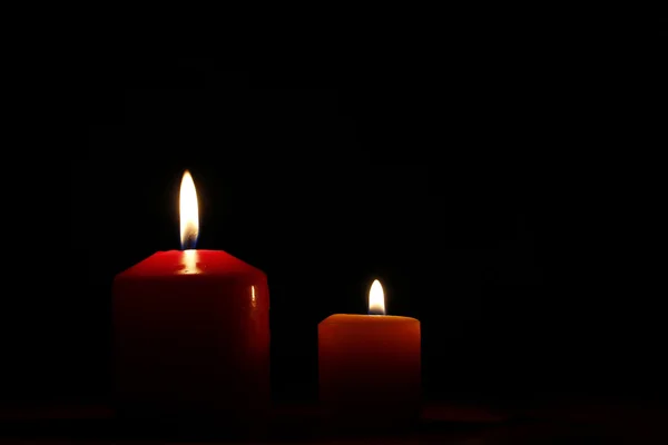 Two candle flames in a dark background — Stock Photo, Image
