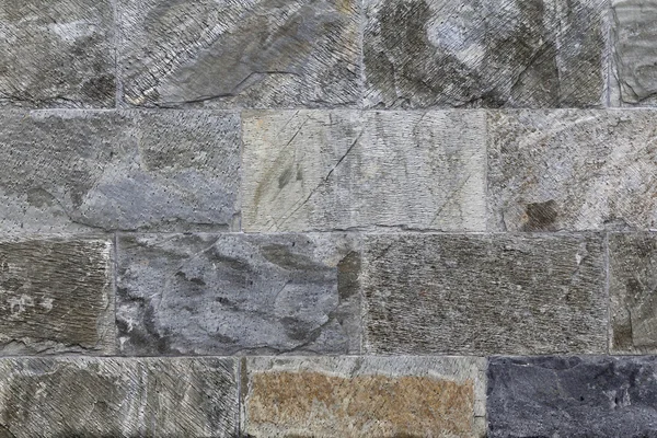 Gri taş duvar, inşaat malzemesi döşenir — Stok fotoğraf